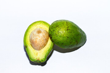 Photo of avocado halves and seeds.