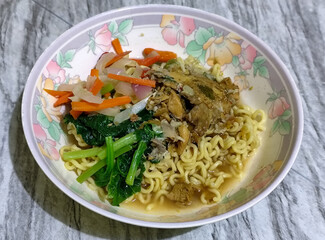 Mie, Mie ayam, mi ayam, or bakmi ayam is a common Indonesian dish consisting of seasoned yellow wheat noodles topped with chicken pieces. This dish originates from Chinese culinary techniques.