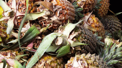 Fresh pineapple displayed in a fruit stall