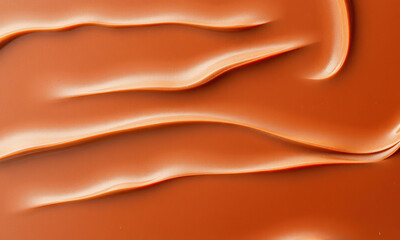 Fototapeta premium Smooth chocolate surface with rich, creamy texture and flowing patterns, perfect for desserts and culinary presentations
