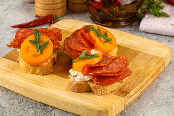 Bruschetta with sausage and tomato