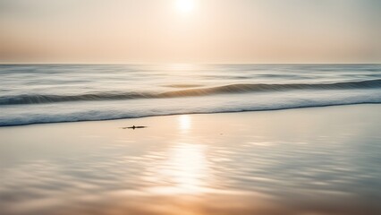 Obraz premium Serene sunrise seascape with a gentle wave washing ashore on a tranquil beach.