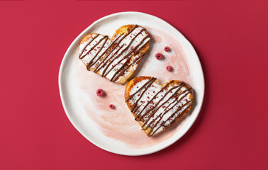 Heart-Shaped French Toast with Chocolate and Berries. Valentines Day breakfast.