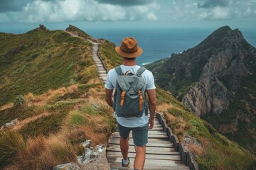 Tourist walking on wooden path exploring coastline cliffs and ocean views