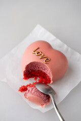 Heart-shaped mousse dessert with Love Inscription. Valentines Day dessert.