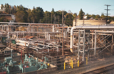 Fototapeta premium Industrial pipes and tanks at outdoor facility