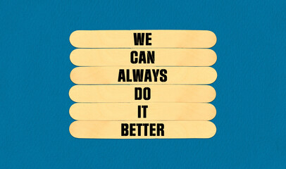 We Make it Better Symbol. Concept word We Can Always Do It Better on beautiful wooden stick. Beautiful Blue Chart Paper Background. Business and We Make it Better concept. Copy space