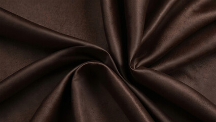 Fototapeta premium Black dark chocolate brown background made of silk satin fabric. Drapery fold crease