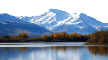 Majestic snow capped mountains reflected in a calm lake.