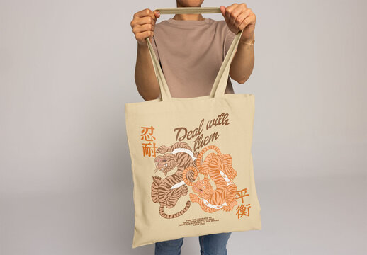 Anonymous Woman holds a blank tote bag, perfect for custom logos or designs for events and marketing.