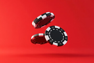 Three poker chips falling from the top, bouncing off a wooden table surface.