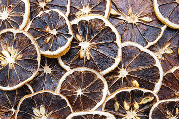 Dried lime fruit slices, textured background
