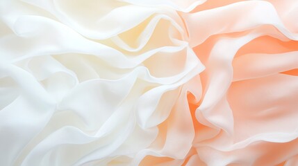 Obraz premium Close-up of delicate, flowing fabric layers in soft white and peach tones, creating an elegant and soothing abstract background.