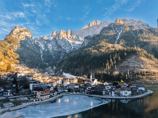 Aerial drone view of the Alleghe village, Italy in daylight