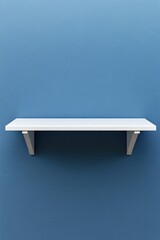 Minimalist white shelf on blue wall backdrop for product display or interior design concept