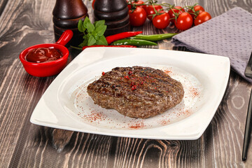 Grilled beef burger cutlet with sauce