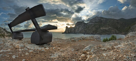 Russia. The Republic of Crimea. A good place to admire the sunset at Cape Kapchik, where wooden benches are specially installed for this purpose.
