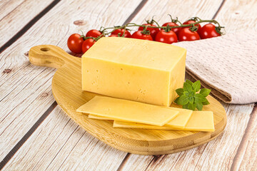 Yellow cheese piece with slices