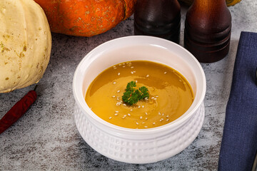 Vegan pumpkin cream soup served sesam