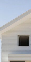Modern architectural design featuring a clean white facade and open window on a sunny day