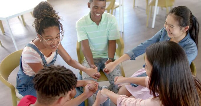 Diverse students engage in a team-building activity at high school