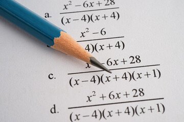 Pencil on mathematic formula exercise test paper in education school.