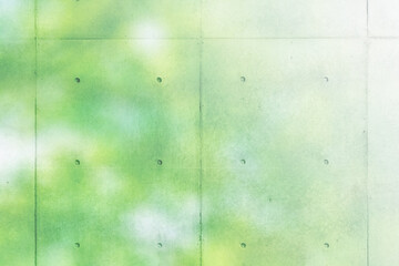 コンクリートの壁　ぼやけた木の葉