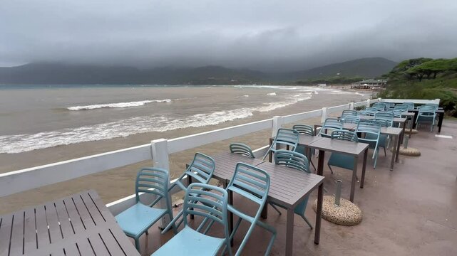 Coastal cafe  in Lacona village on Elba island in Tuscany, Italy on a cloudy day