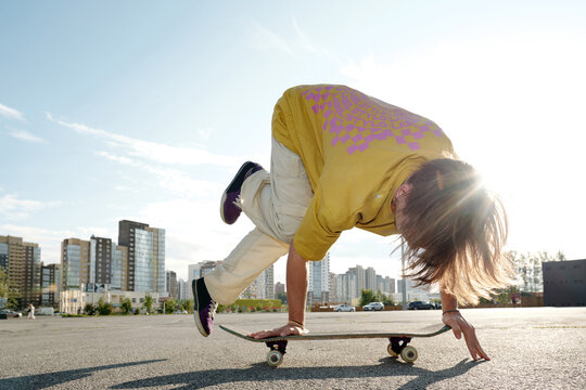 Skateboarding on Urban Street Performing Tricks