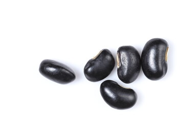Black beans close up, isolated on white background, top view.	
