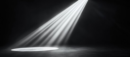 Obraz premium Single spotlight shining on dark floor.