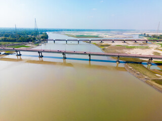Fototapeta premium Aerial View of Dual Bridges Over a Wide River in Rangpur, Bangladesh