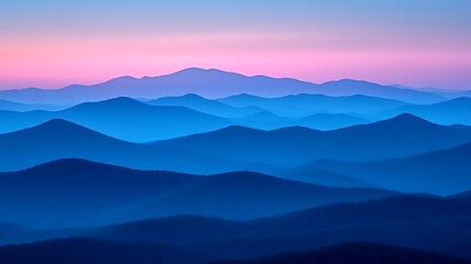 Fototapeta premium A peaceful sunset view from a mountain ridge, with a vast valley and the warm colors of dusk in the sky.