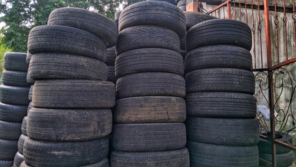 Obraz premium Pile of used car tires,various patterns of car tires. Used car tires texture
