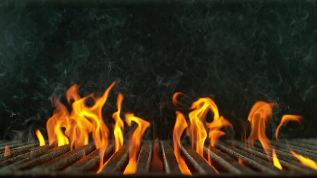 Super Slow Motion of Fire Flames with Cast Iron Grate Isolated on Black Background . Filmed on High Speed Cinema Camera at 1000 fps