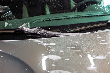 Installation of a protective paint and varnish transparent film on the car. PPF polyurethane film...