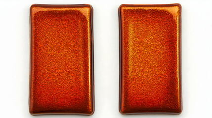 Fototapeta premium Two rectangular copper-colored tiles isolated on white background