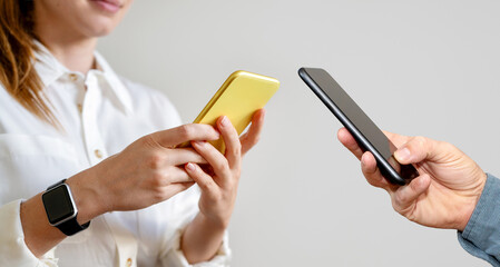 Digital transformation and data exchange. Mobile phones in hands.