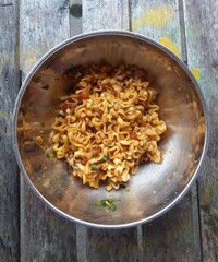 Instant noodles in a bowl.Eating noodle soup. Homemade speed food. Asian dishes.