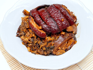 Braised pork belly cooked with soy sauce, salted vegetables, and shiitake mushrooms is a traditional Chinese cuisine with a great combination of salty and savory flavors.