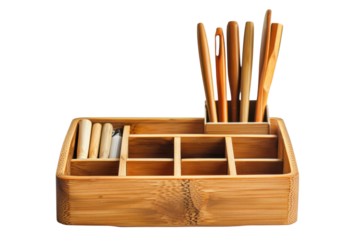 A beautifully organized bamboo utensil holder showcasing a variety of kitchen tools and writing instruments on a neutral background isolated on transparent background