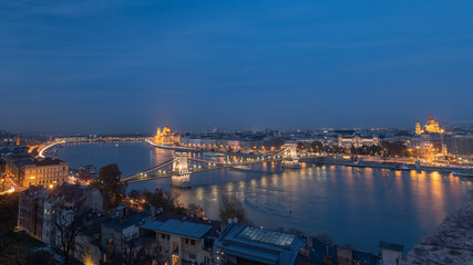 Panoramic view of the Danube River, Szechenyi Chain Bridge, St. Stephen's Basilica and Parliament of Hungary at night