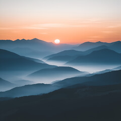 Obraz premium Serene Sunrise in the Mountains: Layers of misty mountains stretch to the horizon, painted in shades of blue and purple as the sun rises, casting a warm golden glow.