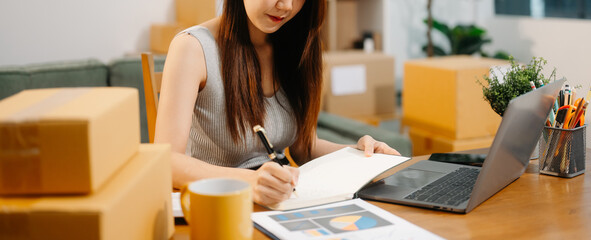 Startup small business SME, Entrepreneur owner woman using smartphone or tablet taking receive