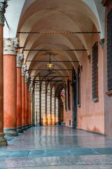 Portico columns on Piazza Santo Stefano in Bologna old town, Emilia Romagna, Italy. Porticoes...