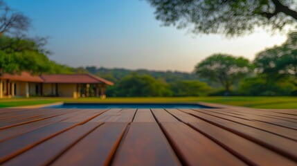 Tranquil outdoor scene featuring a wooden deck overlooking a serene pool and lush greenery