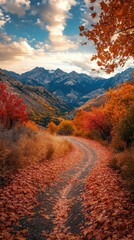A winding path in the wilderness with a mountain vista, framed by vibrant autumn leaves.