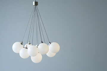 Modern chandelier with a cluster of hanging white glass orbs isolated on white background