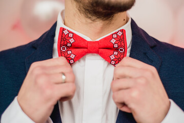 stylishly dressed man corrected bow tie