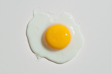 Sunny Side Up: A perfectly fried egg with a bright yellow yolk and a gently spread white, ready to be enjoyed. 